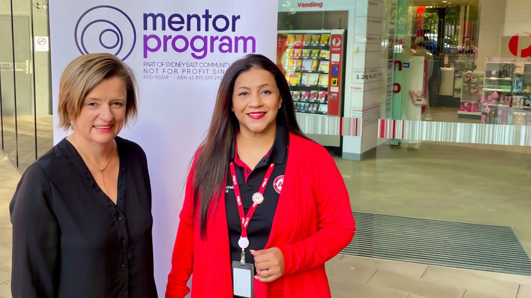 photo-two-women-standing-in-front-of-post-office-mentor