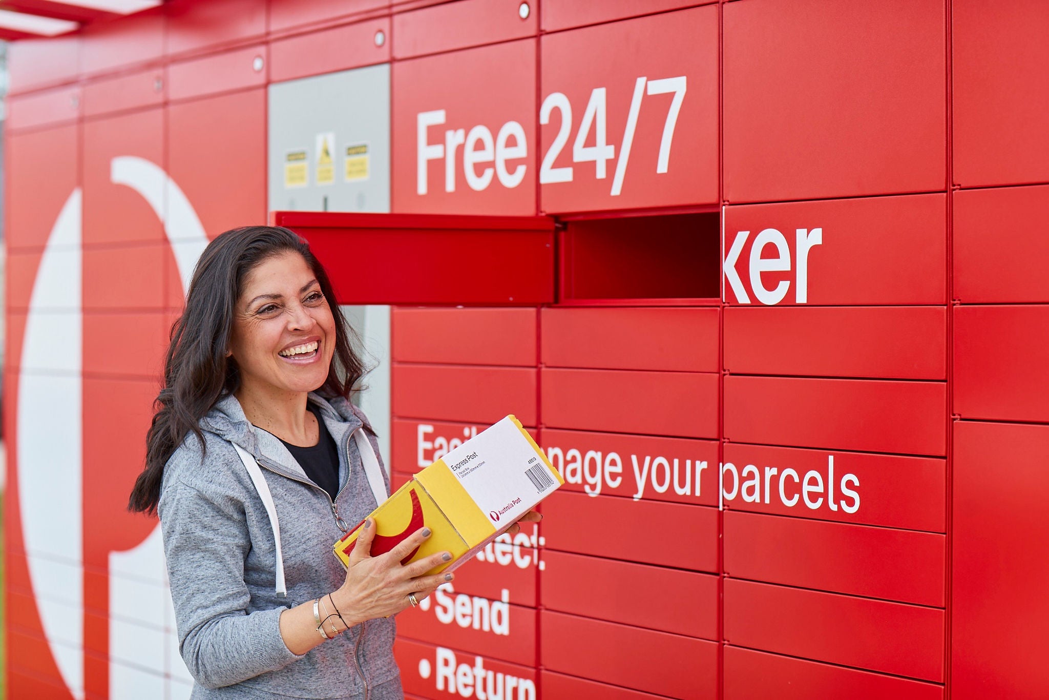 photo woman using parcel locker.