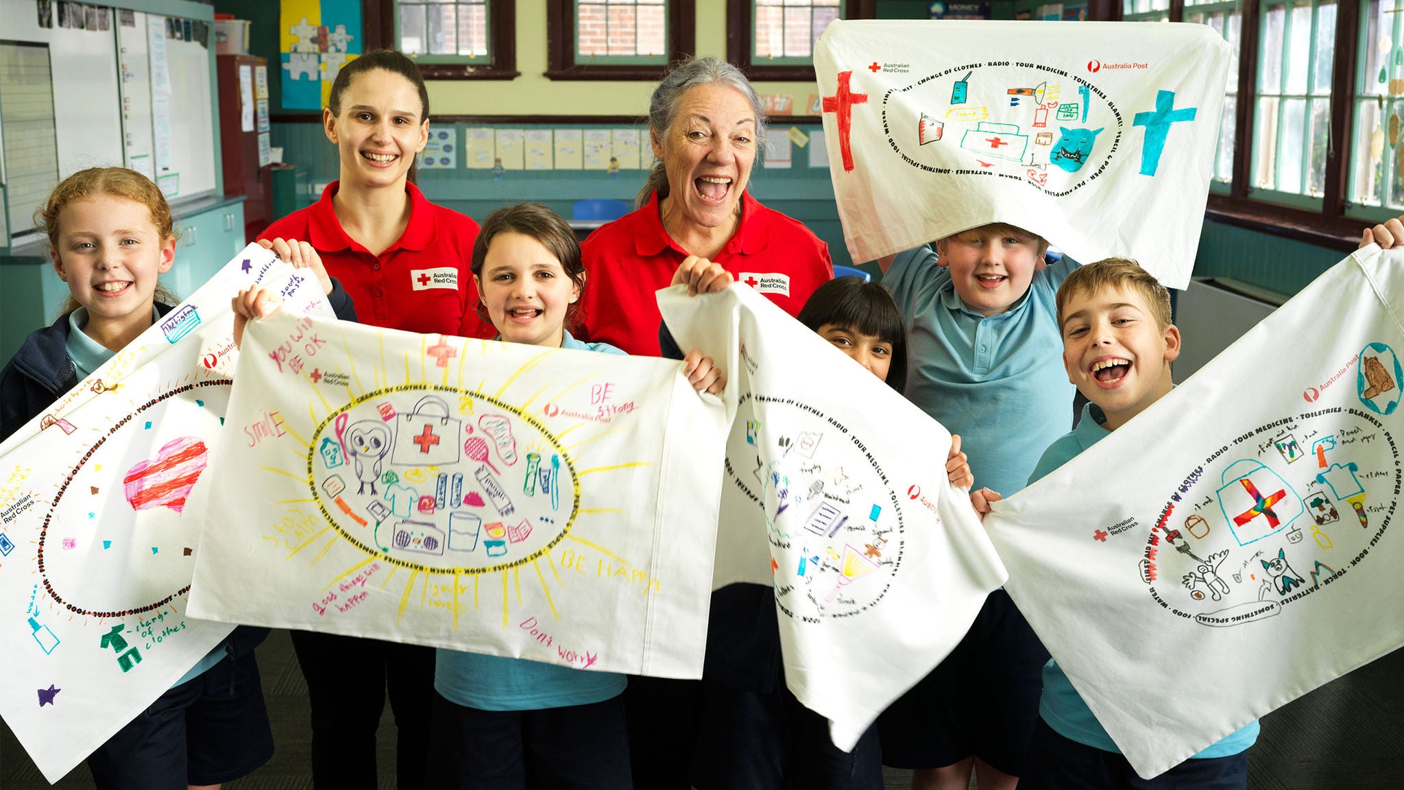 photo-two-women-red-cross-shirts-children
