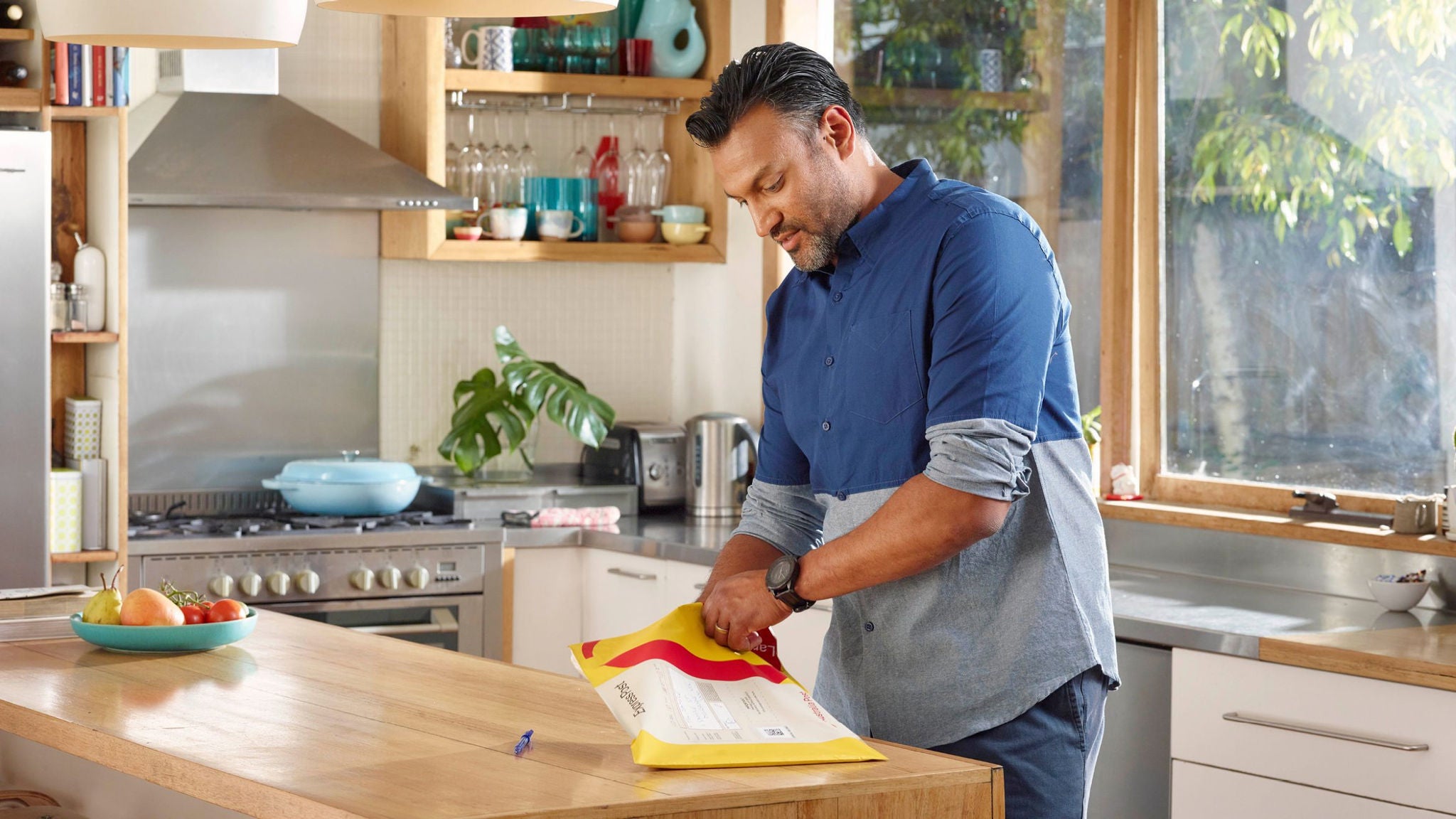photo-man-blue-shirt-kitchen-express-post-satchel