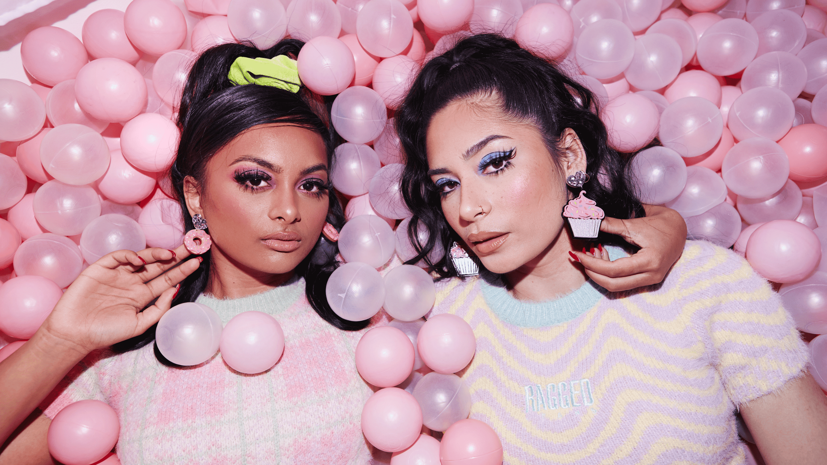 Two women wearing Haus of Dizzy jewellery.