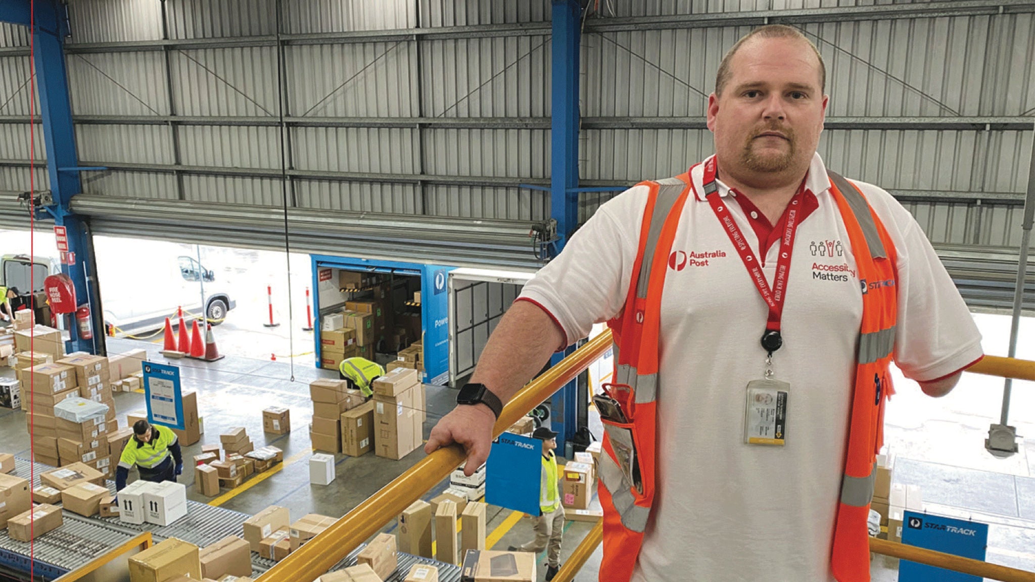 photo-male-employee-standing-in-parcel-facility