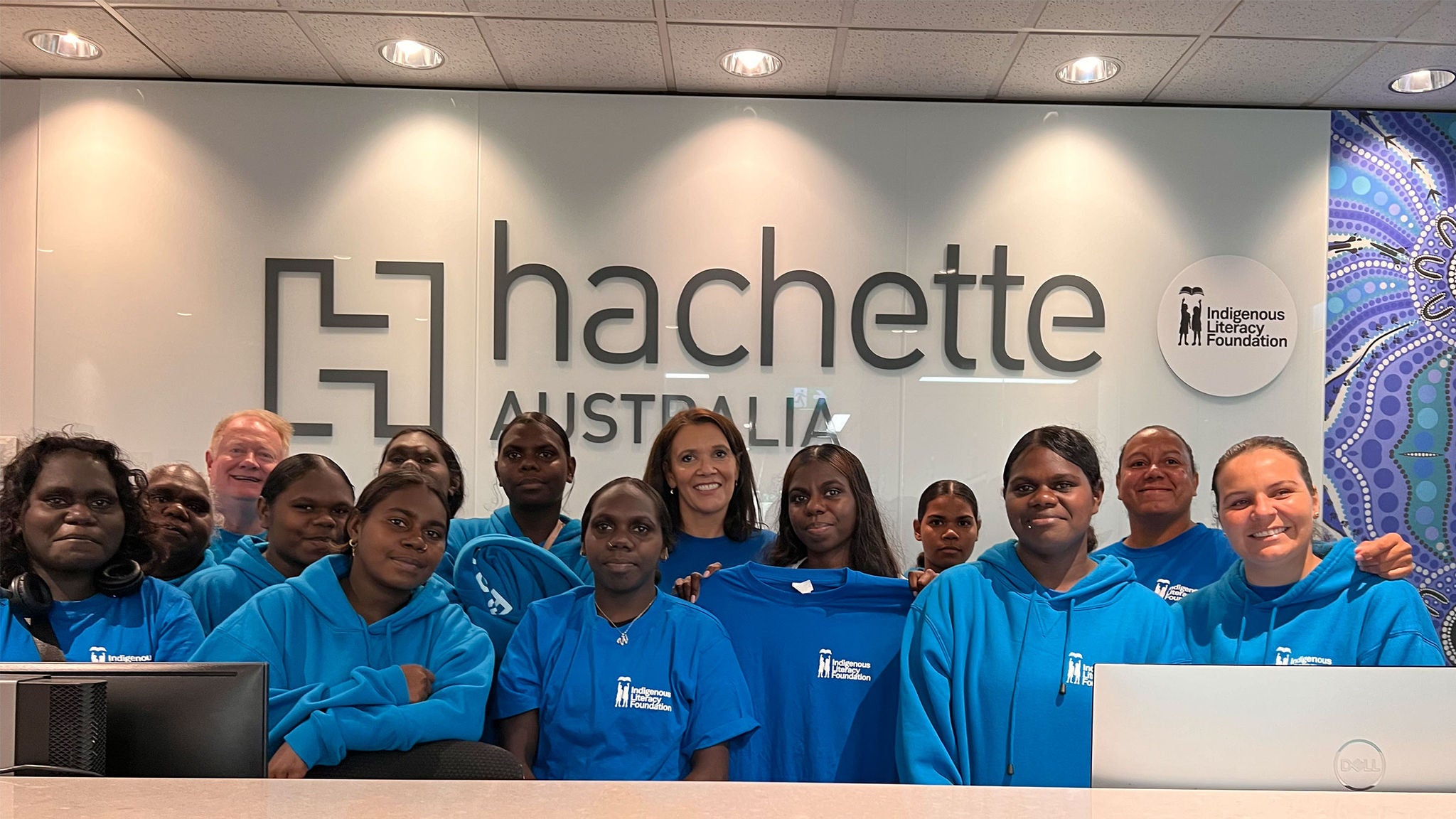 photo-a-group-of-young-first-nations-girls-standing-in-front-of-the-hachette-signage
