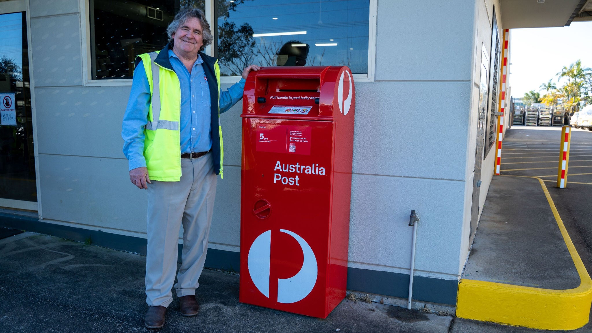 matthew-wilson-with-red-australia-post-box-spb-at-lismore-delivery-centre.