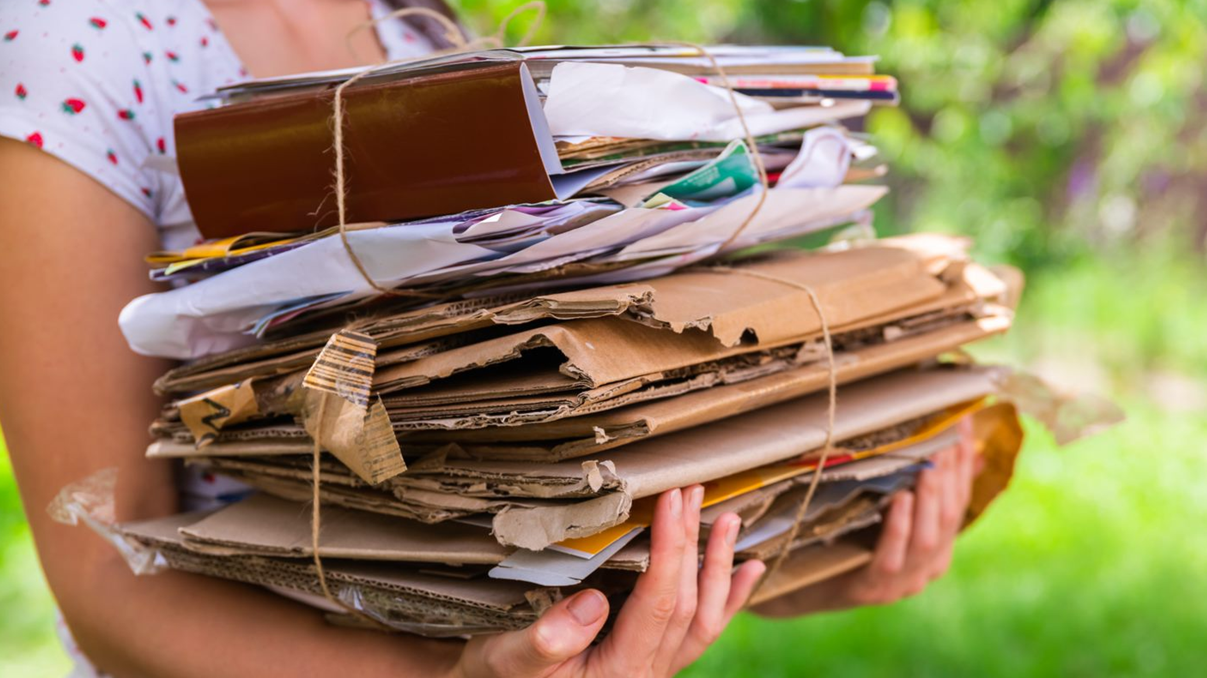 photo-woman-holding-recycling-cardboard-paper