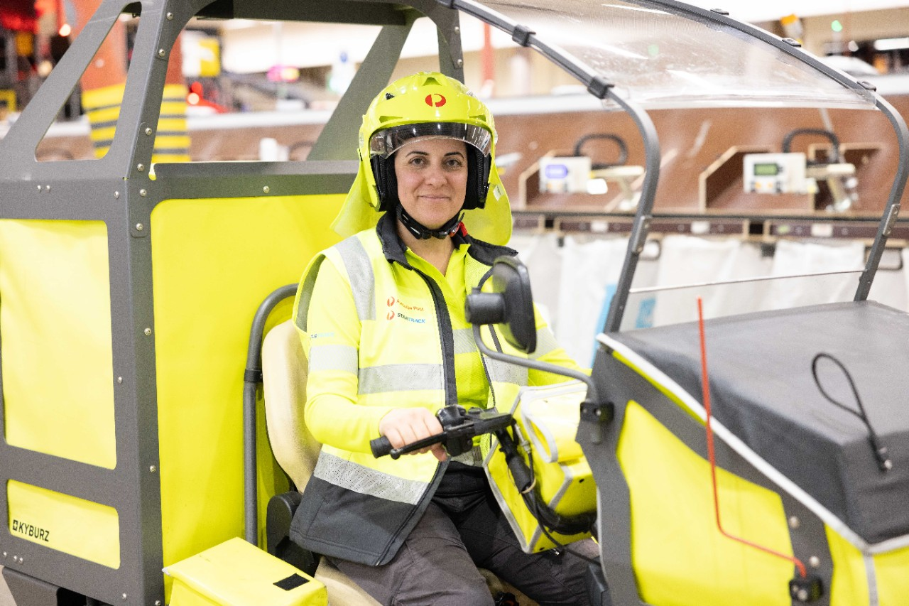 A postie sitting in an EDV