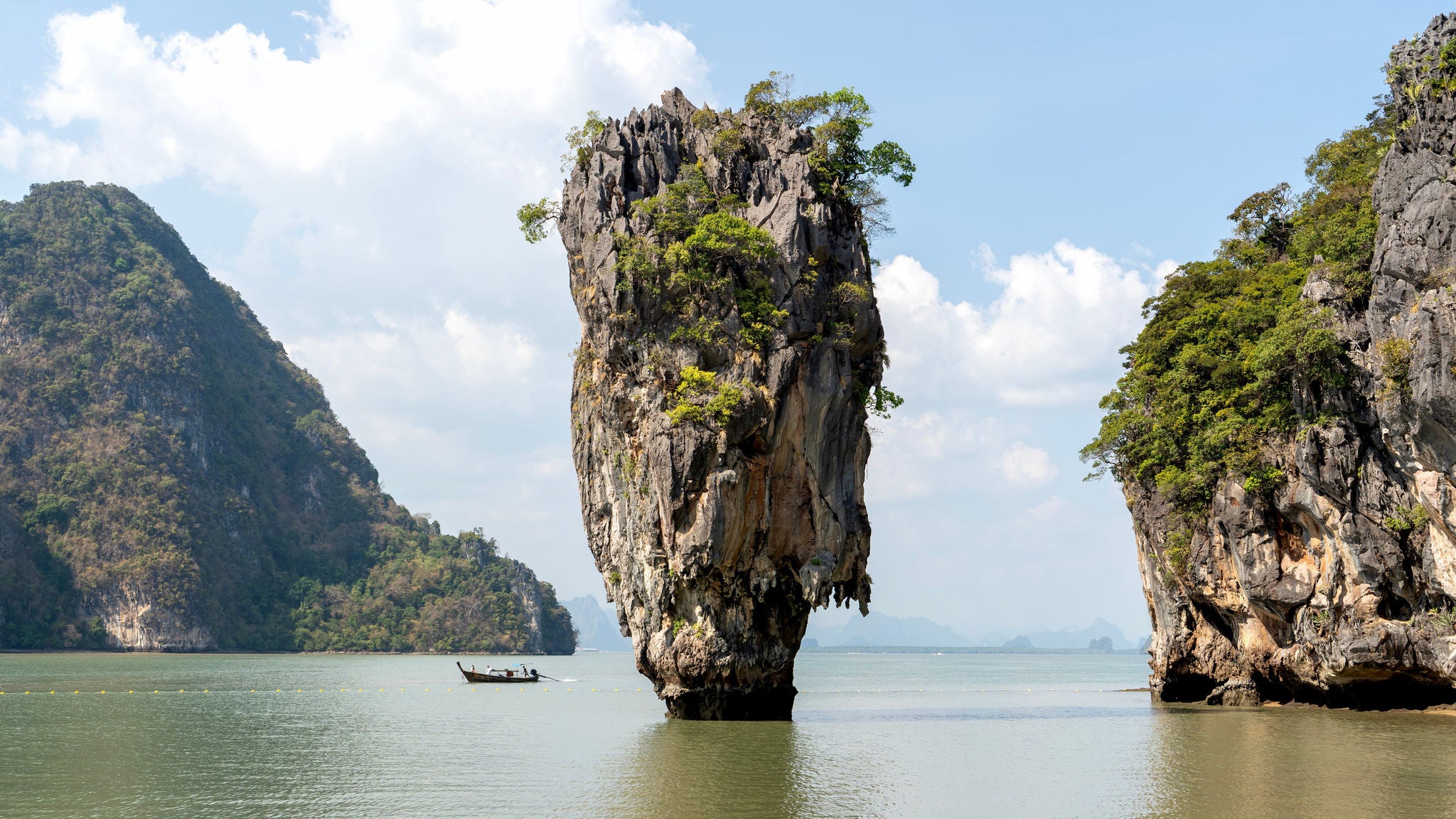 photo-travel-rock-formation-island-boat-water-min