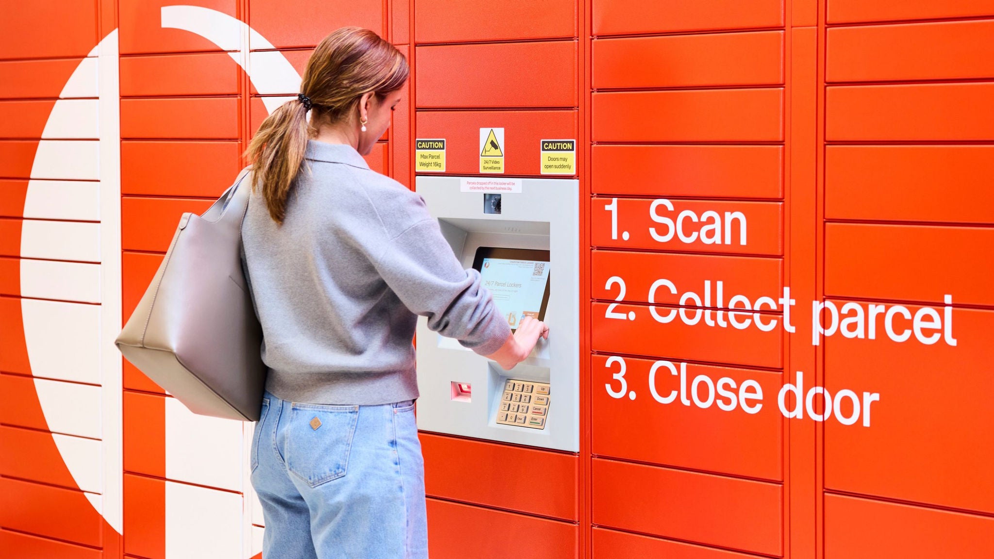 Woman using a parcel locker