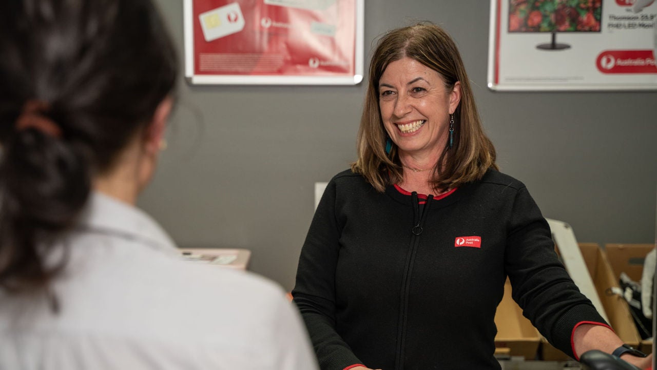 photo-tina-cotroneo-ballina-post-office-smiling-min